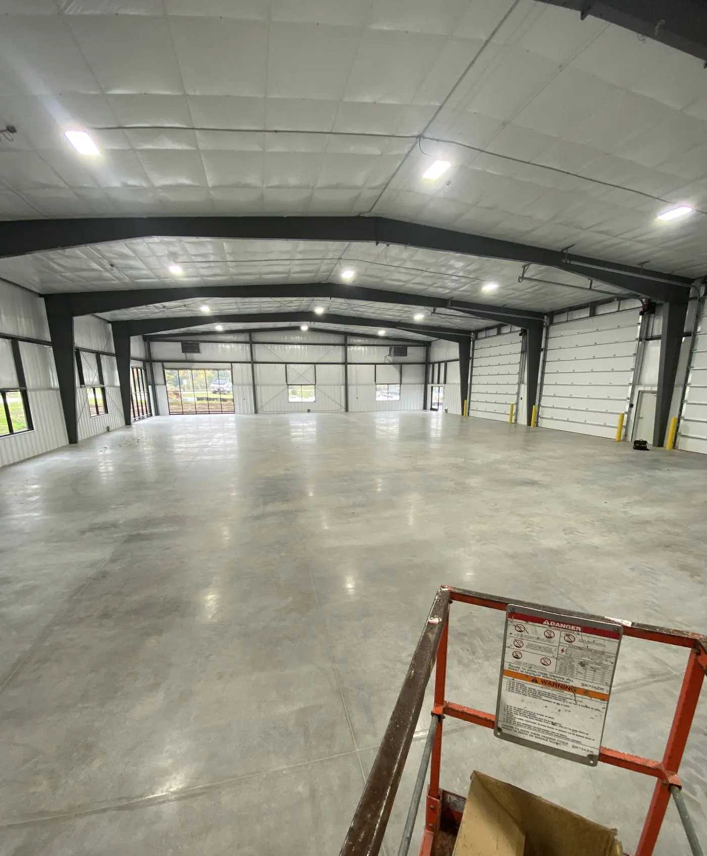 Inside a large industrial warehouse on a Brimmer job